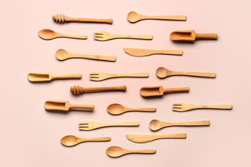 Wooden kitchen utensils on beige background
