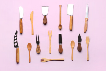 Wooden kitchen utensils on lilac background