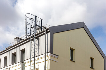 old industrial building with outdoor fire escape after renovation works