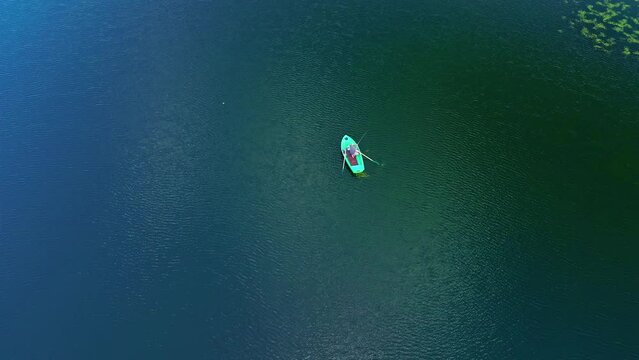 Aerial View Of Person In The Boat Fishing In The Lake. 