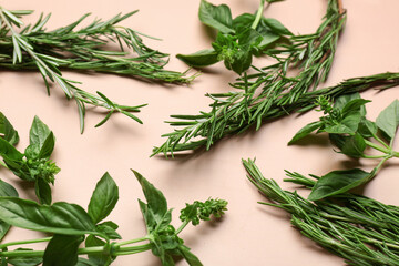 Different fresh herbs on color background, closeup