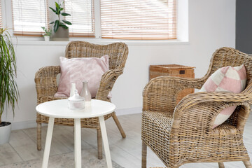 Wicker armchairs and table in living room