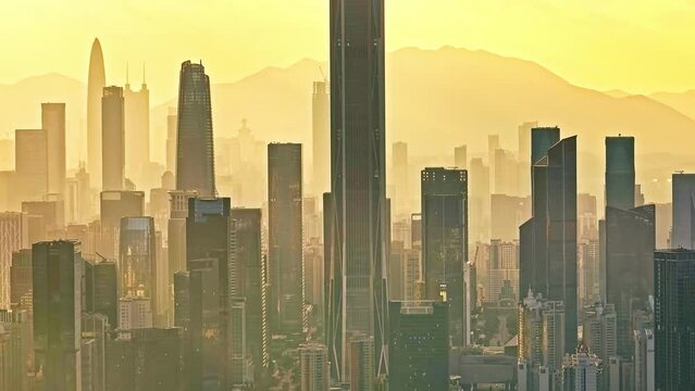Aerial photography of city buildings skyline and nature scenery at sunset in famous Shenzhen, China