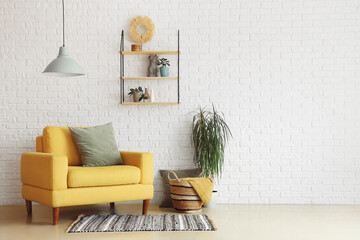 Interior of living room with stylish yellow armchair