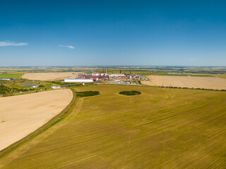 Illuminated potassium salt mine landscape among fields