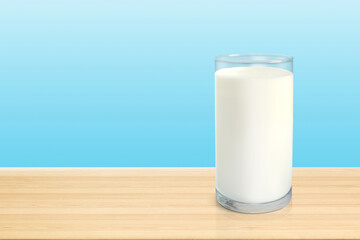 Milk in glass on wooden table isolated on blue background