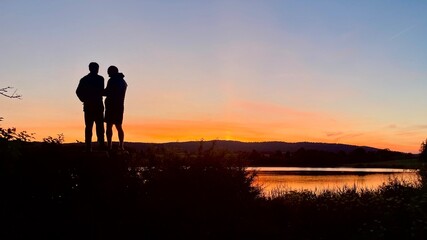 two friends during a sunset, Lac de l’Abbaye, Jura, France.