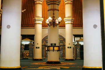 mosque countryInterior in the main building with 5 from 13 sturdy pillars of the Sumenep Great Mosque or Masjid Jamik Sumenep, Madura, East Java, Indonesia