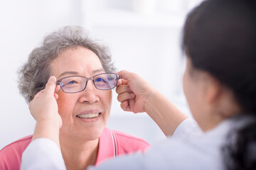 Vision, glasses with doctor and patient, eyes health and optometry, senior woman with doctor at clinic.