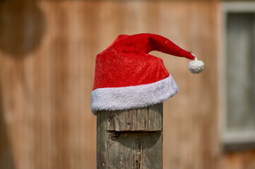 santa Claus hat is put on a pole