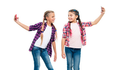 Obraz premium school children making selfie. girls children having selfie time. school friends capture fun with selfie. friendship concept. heartwarming friendship selfie. Lifelong school friends