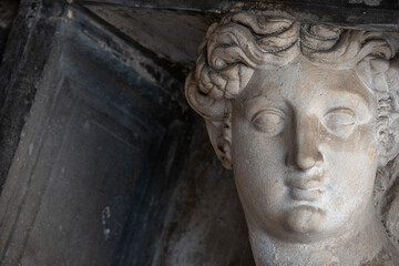 Venice, Italy - Banner with portrait with a ancient statue of a beautiful woman, Greek or Italian as a telamon at San Macro Square in Venice, Italy, with copy space