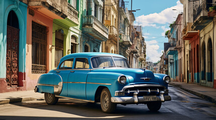 A blue oldtimer taxi is driving through Habana