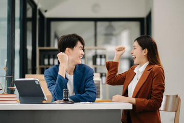 business people and lawyers discussing contract papers sitting at the table. Concepts of law, advice, legal services. in morning light