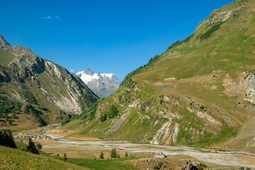 Fototapeta na wymiar beautiful landscape in european alpine valley with the glacier of Mont Blanc background