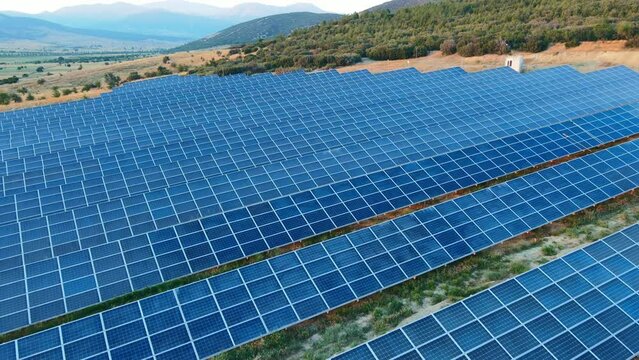 Aerial view of solar panels stand in row, renewable energy concept with carbon neutral