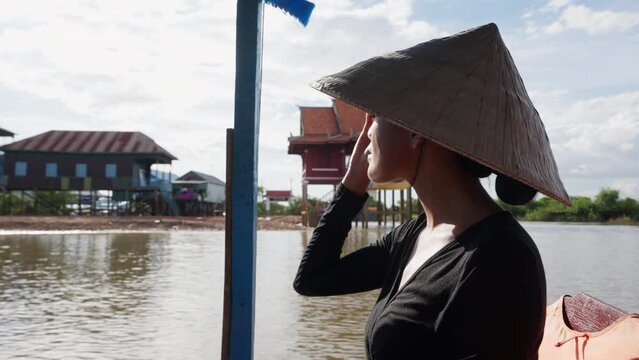 A Woman Reaching A Floating Village