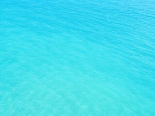 Top view of shiny wave of clear blue sea water, Blue background