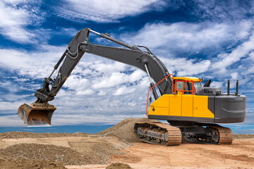 excavator is in work and digging at construction site