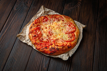 Mini pizza on brown boards. Bakery products. Fresh bakery.