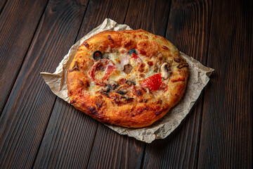 Mini pizza on brown boards. Bakery products. Fresh bakery.