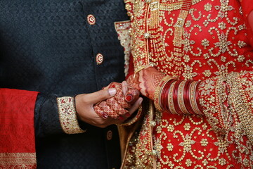 henna on hands, groom holding hands bride holding hands , wedding photoshoot