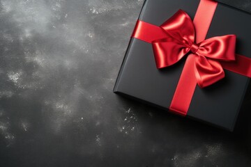 Gift box with red ribbon top view, copy space. Black Friday Sale