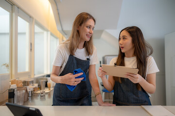 Barista workers are prepared at the counter pantry of coffee. Man and women enjoy their work....