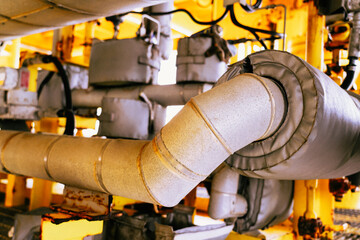 Insulation foam covered with a good waterproof rubber sheet on pipes in offshore oil and gas processing.