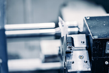 Macro Machine iron tools CNC cut of metal with light spark, technology modern industrial