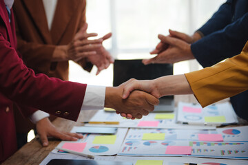 Two confident business man shaking hands during a meeting in the office, success, dealing, greeting...