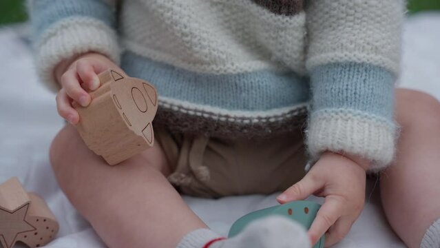 Infant Playing With Wooden Blocks