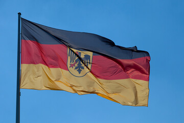 German flag waving atop of its pole