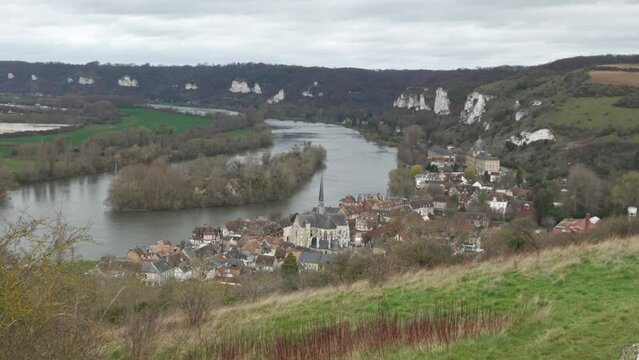 Scenic view of les andelys, river bend and quaint village, overcast day