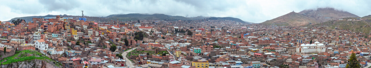 Fototapeta na wymiar High distant and panoramic view of Potosi city. Neighborhood with houses in a poverty situation and low resources due of the mining industry for centuries. Bolivia. Southamerica