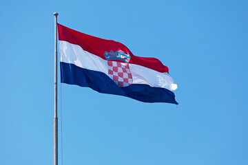 Croatian flag waving atop of its pole