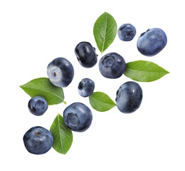 Many ripe blueberries and green leaves falling on white background