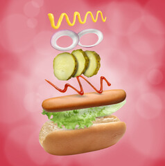 Hot dog ingredients in air on red background
