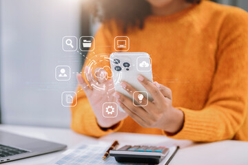 Woman is using a smartphone to access the cloud computing system , Storage and data transfer Cloud...