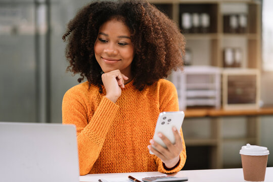 Email notification concept, Female use smartphone and laptop receive message alert in the mailbox.
