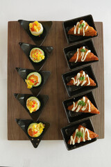mini bites scallop mango salad and bbq prawn paste bread canapés butler in small plate in white background appetiser Christmas festival party halal food hotel cuisine restaurant menu