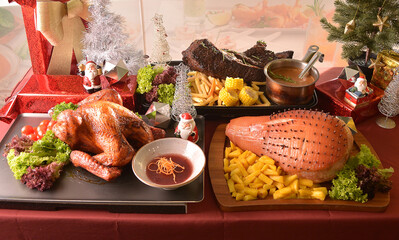 Merry Christmas happy season party buffet eve night with bbq roast whole turkey, honey pork ham, bulgogi beef and brown sauce on red table with Christmas decoration halal food restaurant cuisine menu