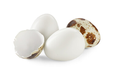 Unpeeled and peeled boiled quail eggs on white background