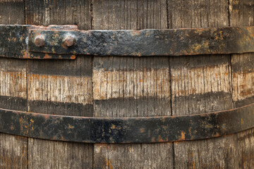 Traditional wooden barrel as background, closeup. Wine making