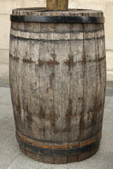 Traditional wooden barrel on street outdoors. Wine making