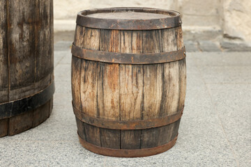 Traditional wooden barrel on street outdoors. Wine making