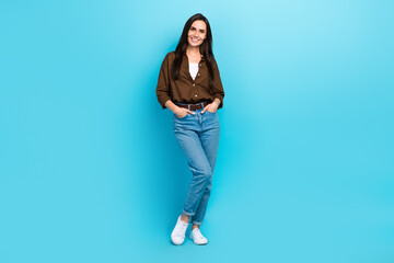 Full body photo of young business woman hands pockets denim jeans posing model vogue levis brand clothes isolated on blue color background