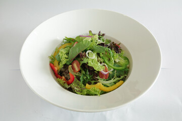 chef seasonal green pepper vegetables with salad dressing sauce appetiser in bowl on white background appetiser Christmas festival party halal food hotel cuisine restaurant menu