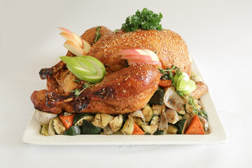 chef bbq roasted grill marinated whole big turkey chicken meat with mixed potato vegetables in plate on white background appetiser Christmas festival party halal food hotel cuisine restaurant menu