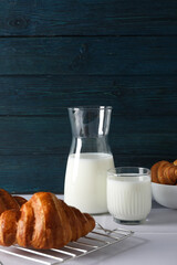Breakfast tasty food concept - milk with bakery products